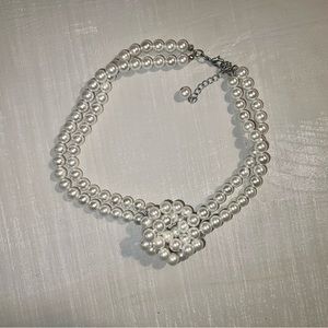 Pearl necklace with multiple strands